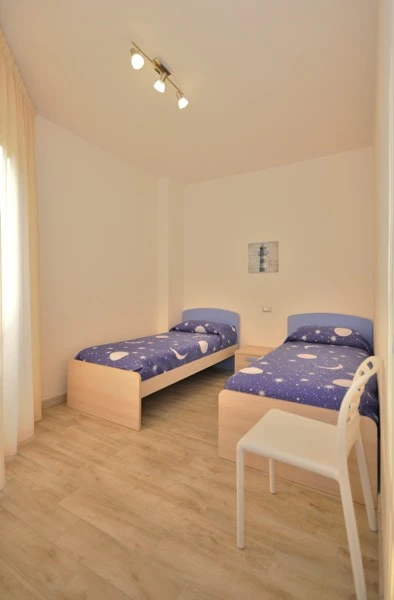 Ložnice s lůžky v apartmánu Residence Corso Bibione | Bibione / Residence Corso
