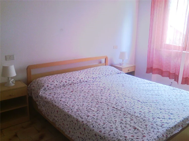 Residence Sul Mare – pokoj s postelí a výzdobou | Villa Rosa / Residence Sul Mare