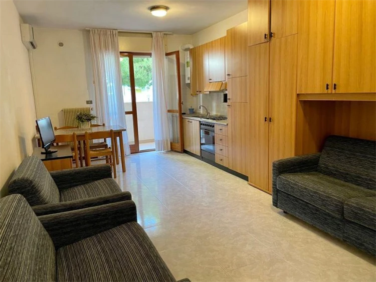 Pokoj v Residence Duca Degli Abruzzi s postelí a světlým interiérem | Caorle / Residence Duca Degli Abruzzi